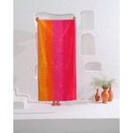 "This soft and plush cotton towel with a beautiful ombré hot design will become your go-to for beach days."