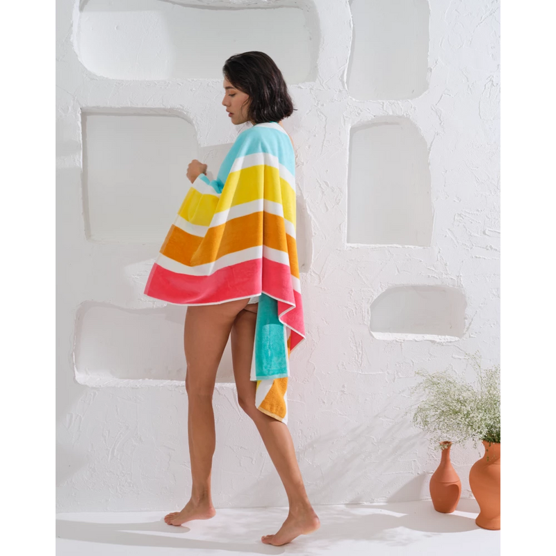 Make a statement with this brightly striped beach towel.