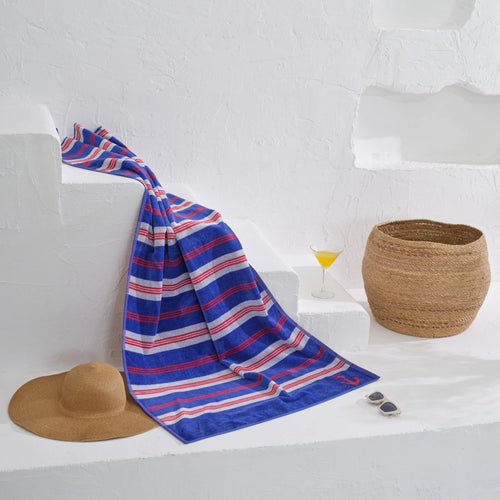 Get ready for a day of relaxation with our luxurious beach towel in a stylish navy stripe design.
